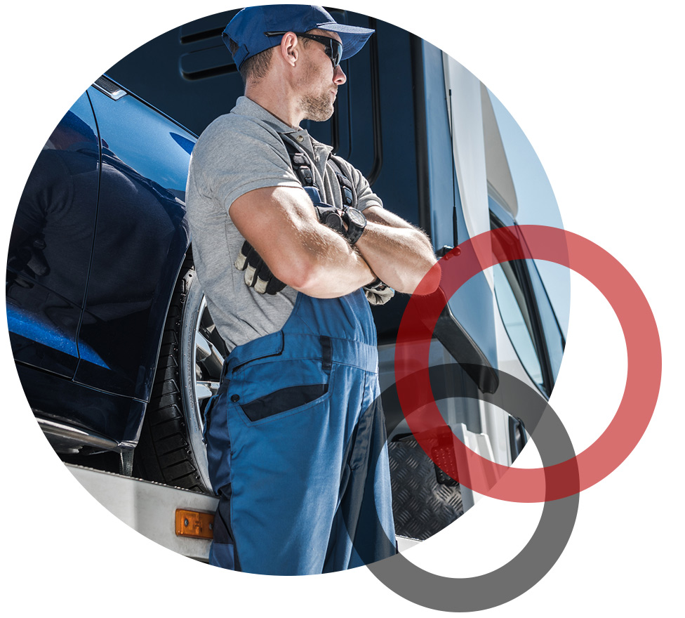 Quality 1st Towing Expert Standing infront of a Tow Truck in Newark NJ Area